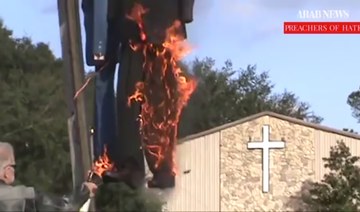 Terry Jones burning effigies of Obama and Clinton